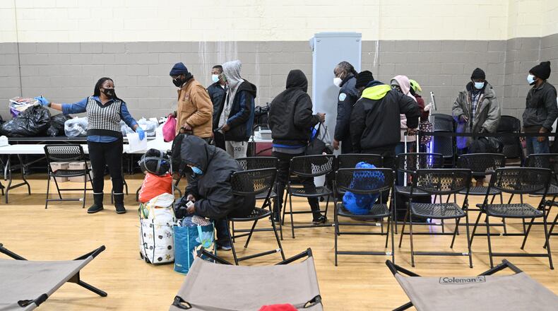 December 22, 2022 Atlanta - People are checking in as they enter the Old Adamsville Recreation Center warming center on Thursday, December 22, 2022. The City of Atlanta recently announced to open multiple warming centers as temperatures drop across metro Atlanta. (Hyosub Shin / Hyosub.Shin@ajc.com)