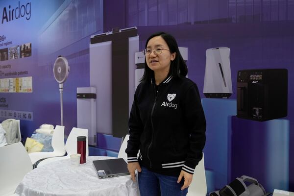 Zhang Haiyun, overseas sales director of Airdog, a Chinese air purifier manufacturer, speaks at the 137th Canton Fair in Guangzhou, southern China's Guangdong province on Tuesday, April 15, 2025. (AP Photo/Ng Han Guan)