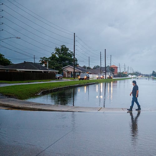 The West Esplanade Ave. canal in Kenner slowly recedes after over topping during Tropical Storm Arthur in New Orleans, Thursday, June 18, 2026. (David Grunfeld/The Times-Picayune/The New Orleans Advocate via AP)