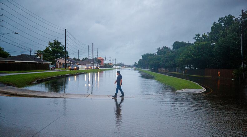 The West Esplanade Ave. canal in Kenner slowly recedes after over topping during Tropical Storm Arthur in New Orleans, Thursday, June 18, 2026. (David Grunfeld/The Times-Picayune/The New Orleans Advocate via AP)