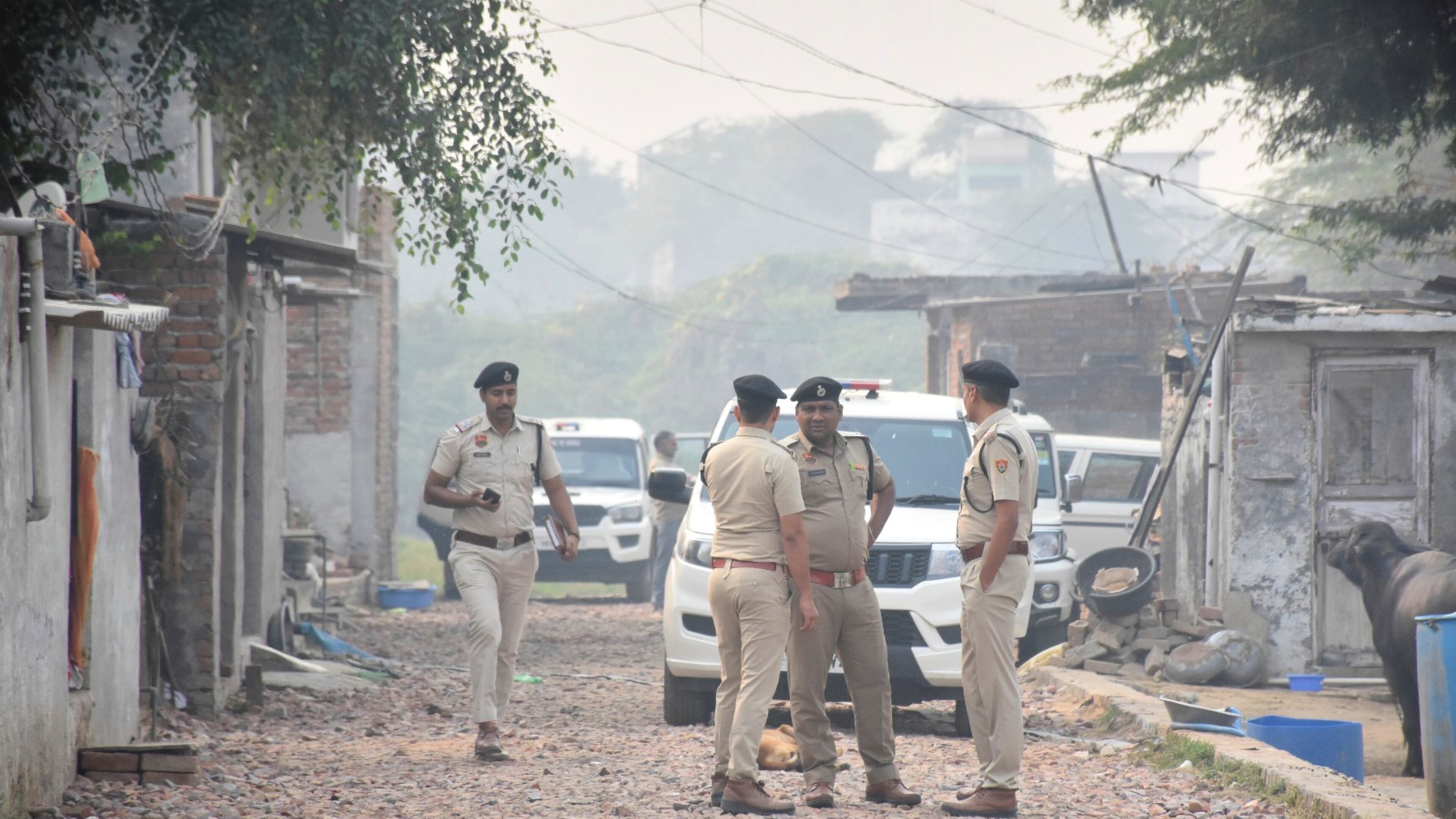Security officials stand outside a house at Fatehpur Tagga, in Faridabad on the outskirts of New Delhi, India, Monday, Nov. 10, 2025. (AP Photo)