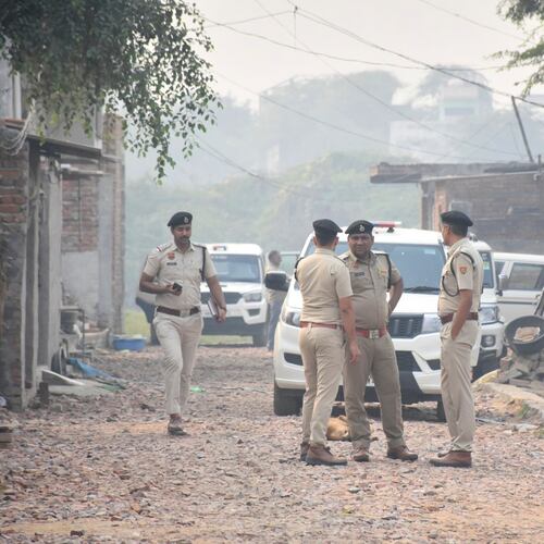 Security officials stand outside a house at Fatehpur Tagga, in Faridabad on the outskirts of New Delhi, India, Monday, Nov. 10, 2025. (AP Photo)