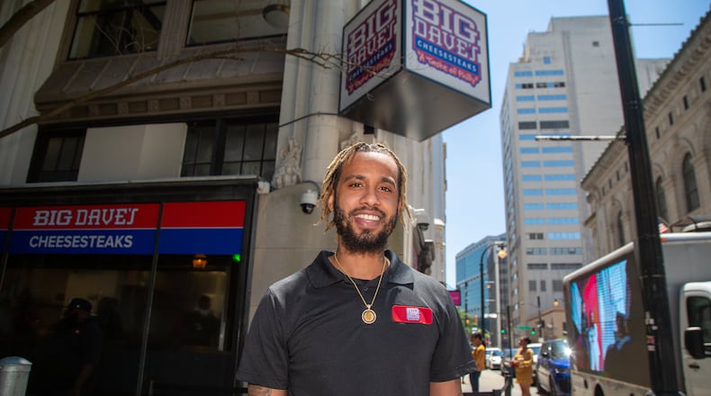 Portrait of Derrick Hayes outside of Big Dave's Cheesesteaks in downtown Atlanta during an event where two Atlanta restauranteurs team up to provide life insurance for Black men. Pinky Cole, CEO and Founder of Slutty Vegan ATL , and D. Hayes, President and CEO of Big Dave's Cheesesteaks, are merging their philanthropic endeavors yet again. The Pinky Cole Foundation and The David & Derrick Hayes Foundation are spearheading Square 1: The Life Experience, a program with an initiative to provide life insurance policies by December 2023 to 25,000 Black men. Eligible participants must be individuals who are between the ages 15-45, earn $30,000 or less annually, and do not use tobacco.
PHIL SKINNER FOR THE ATLANTA JOURNAL-CONSTITUTION.