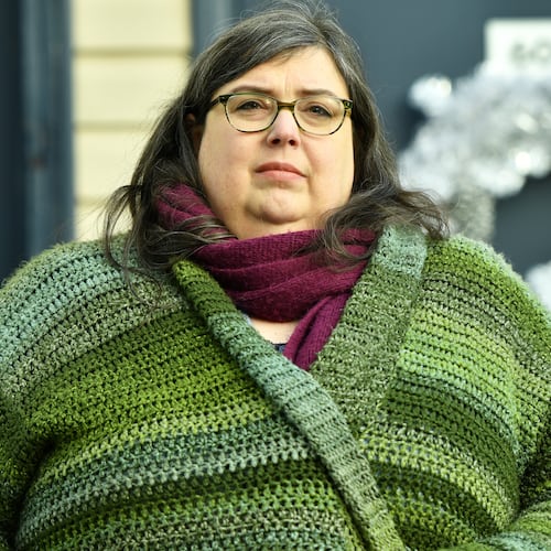 Lynn Weidner, a home care worker who worries that the cost of her health insurance plan in the Affordable Care Act marketplace will rise, poses in front of her home, Thursday, Dec. 4, 2025, in Allentown, Pa. (AP Photo/Marc Levy)