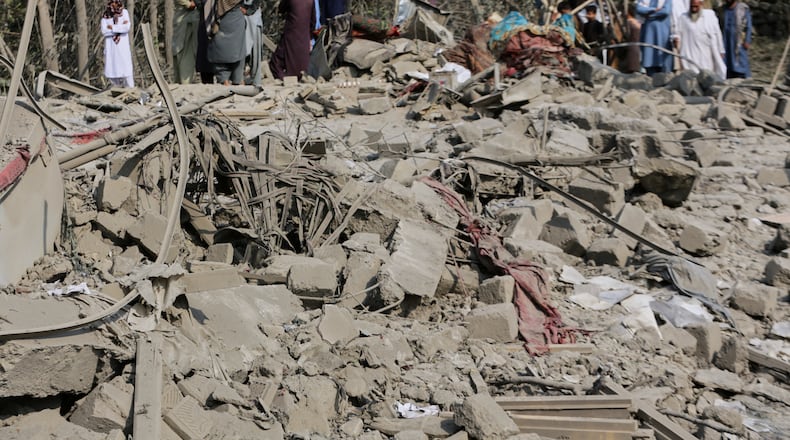 Residents inspect the rubble of a house destroyed in a strike in Patan village, Kunar province, eastern Afghanistan, Monday, Sept. 21, 2026. (AP Photo/Shafiullah Kakar)