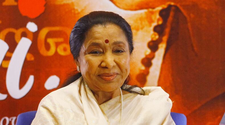 FILE - Indian Bollywood playback singer Asha Bhosle attends the Music launch of Bhosle's film ëMaií in Mumbai, India, Jan. 22, 2013. (AP Photo/Rafiq Maqbool, File)