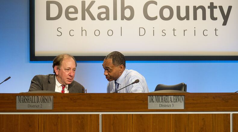 DeKalb County Board of Education members Marshall Orson (left) and Michael A. Erwin (right) talk during a special meeting Monday, Nov. 11, 2019. The board voted 6-1 to cut ties with Superintendent Steve Green. Ramona Tyson, Green’s former chief of staff and a former interim superintendent who now reports directly to the school board, is now the district’s interim leader. ALYSSA POINTER/ATLANTA JOURNAL CONSTITUTION