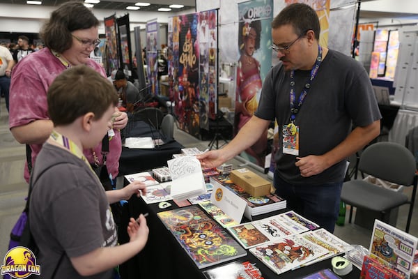 Kids 12 and under can receive a free sketchbook and collect drawings from participating artists at the Comic and Pop Artist Alley. (Courtesy of Dragon Con Photography/Dragon Con Inc.)