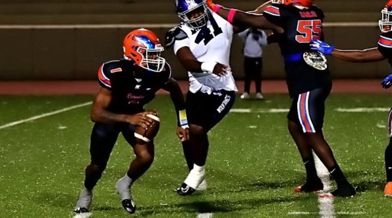 Columbia quarterback Cameron Graves (1) scrambles away from pressure during a game against Miller Grove on Oct. 11, 2024.