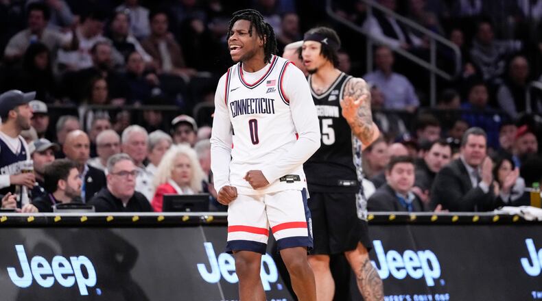 UConn guard Malachi Smith (0) reacts after stealing the ball during the first half of an NCAA college basketball game against Georgetown in the semifinals of the Big East tournament, Friday, March 13, 2026, in New York. (AP Photo/Yuki Iwamura)