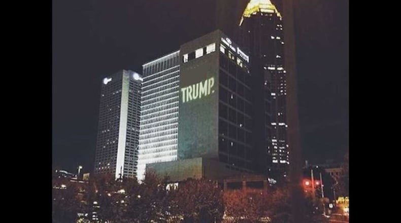 Those riding through Midtown saw “(Expletive) TRUMP” along the side of the Crowne Plaza hotel for about 30 minutes Sunday night, the Metro Atlanta Democratic Socialists of America said. (Credit: Instagram. Photo edited to obscure the expletive.)