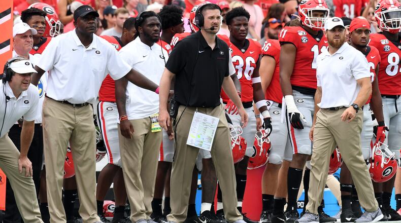 Georgia defensive coordinator Dan Lanning (black shirt) is back to oversee the Bulldogs' defensive pursuits for a third season after turning down lucrative offers to leave for Florida State and Texas the past two years. (Perry McIntyre/UGA)