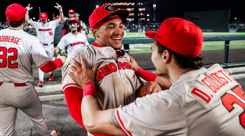 Georgia outfielder Clayton Chadwick (8) is congratulated by teammate Dylan Goldstein after hitting what stood up as the game-winning home run in the toip of the ninth inning of the Bulldogs game against Mississippi State at Dudy Noble Field in Starkville, Miss., on Saturday, April 06, 2024. (Kari Hodges/UGA Athletics)