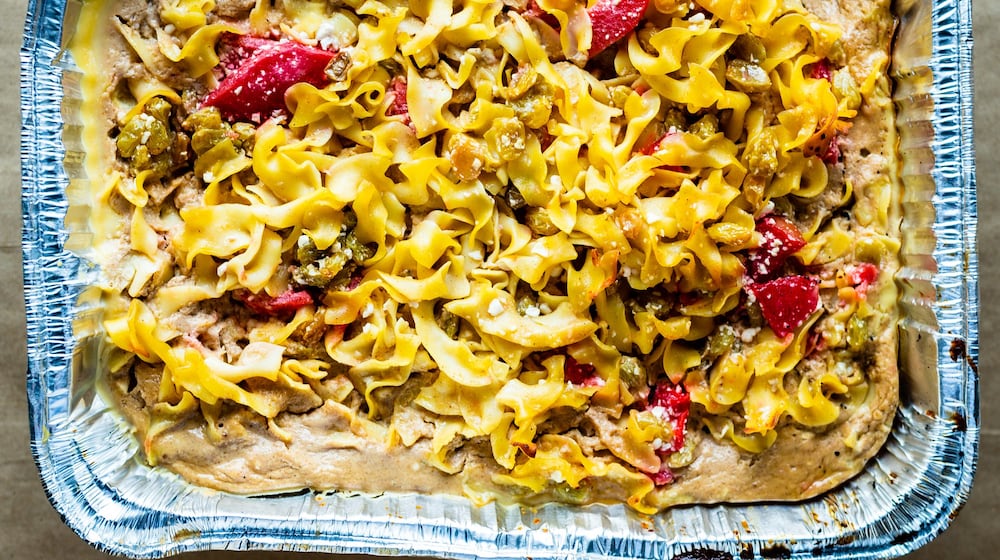 The candy apple and raisin kugel at Bogartz Food Artz has bright red cinnamon apples nestled among the egg noodles. CONTRIBUTED BY HENRI HOLLIS