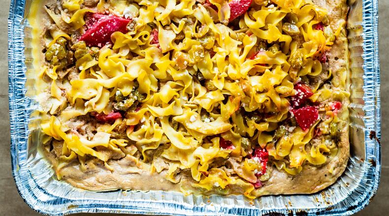 The candy apple and raisin kugel at Bogartz Food Artz has bright red cinnamon apples nestled among the egg noodles. CONTRIBUTED BY HENRI HOLLIS