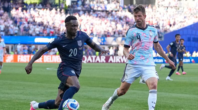 United States' Folarin Balogun (20) and Belgium's Brandon Mechele (4) battle for the ball during the World Cup round of 16 soccer match between the United States and Belgium in Seattle, Monday, July 6, 2026. (AP Photo/Lindsey Wasson)
