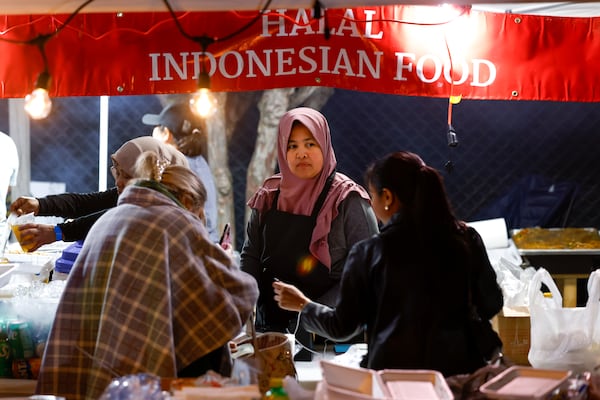 Wuwuh Lailiyana helps customers at the Dragon Delite tent at the Atlanta Ramadan Food Festival in Norcross on Friday, February 27, 2026.