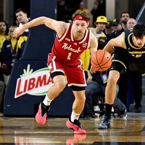 Nebraska guard Sam Hoiberg (1) steals the ball from Michigan center Aday Mara (15) in the first half of an NCAA college basketball game in Ann Arbor, Mich., Tuesday, Jan. 27, 2026. (AP Photo/Lon Horwedel)