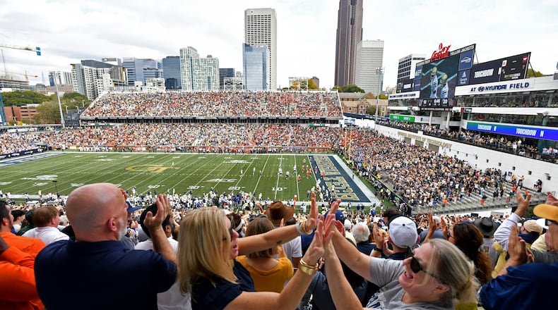 Georgia Tech fans react after Tech wide receiver Chase Lane (7) scored a touchdown during the second half of an NCAA college football game at Bobby Dodd Stadium, Nov. 9, 2024, in Atlanta. (Hyosub Shin/AJC)