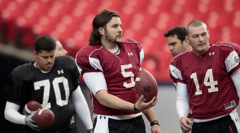 South Carolina quarterback Stephen Garcia (5) walks on the field with teammates Byron Jerideau (70) and Connor Shaw (14) during practice for the Chick-fil-A Bowl NCAA college football game against Florida State Wednesday, Dec. 29, 2010 in Atlanta. (AP Photo/David Goldman) Amazing that Stephen Garcia and Connor Shaw (right) were teammates. Shaw's in NFL. (AP)