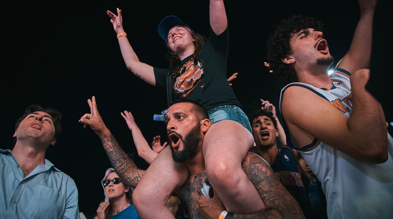 New York Knicks fans celebrate as they watch Game 5 of the NBA Finals basketball series against the San Antonio Spurs, Saturday, June 13, 2026, in New York. (AP Photo/Andres Kudacki)
