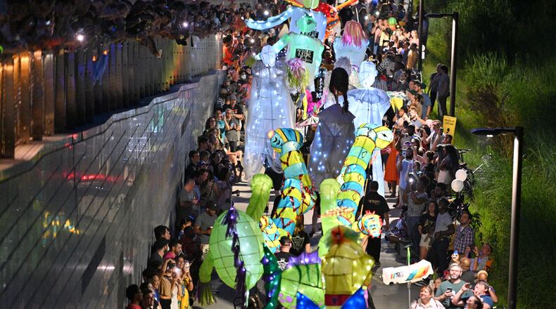 May 21, 2022 Atlanta - Hundreds of parade participants float on the Atlanta Beltline Westside Trail during the 12th Atlanta Beltline Lantern Parade on Saturday, May 21, 2022. (Hyosub Shin / Hyosub.Shin@ajc.com)