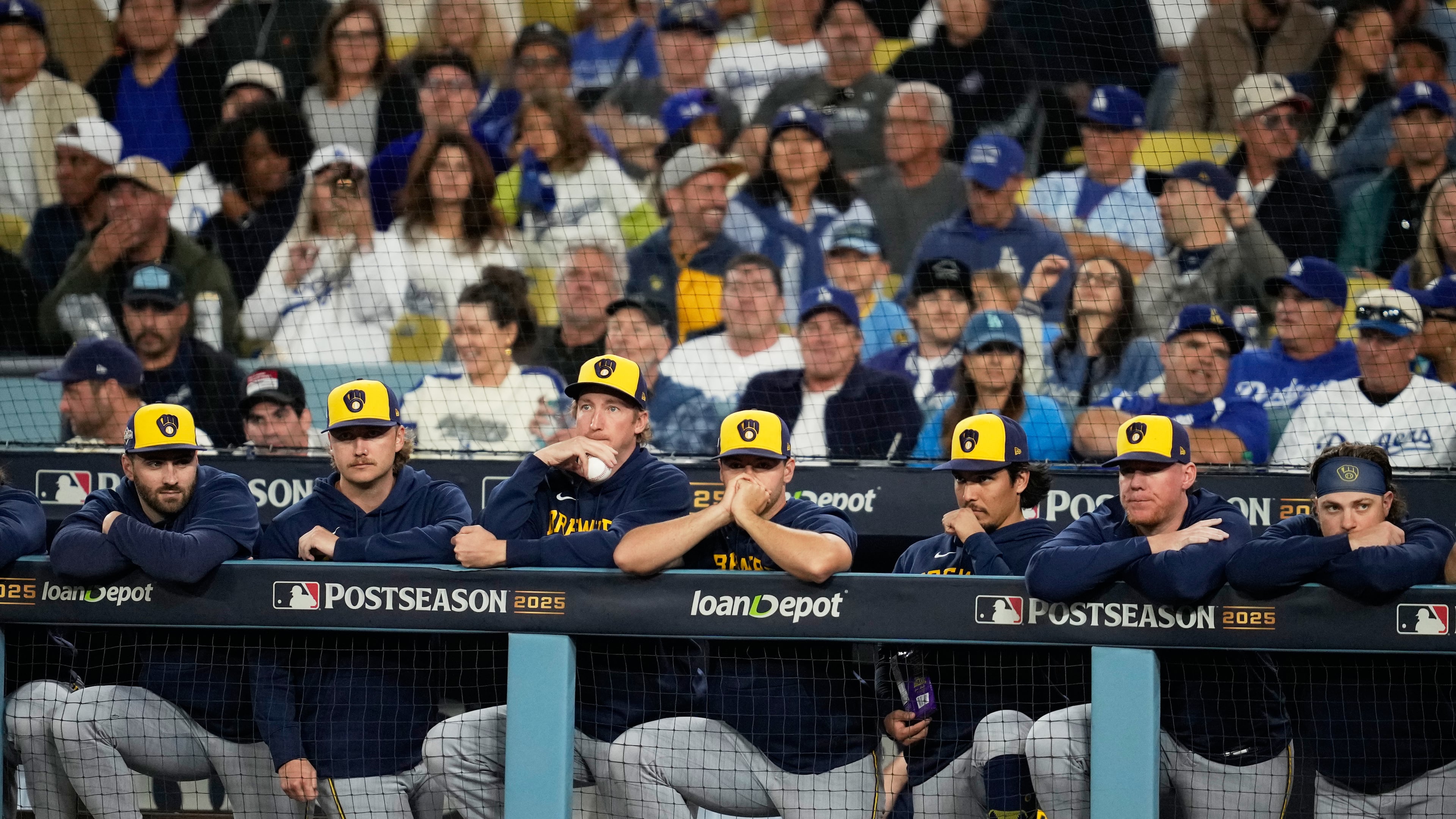 Members of the Milwaukee Brewers watch during the eighth inning in Game 4 of baseball's National League Championship Series against the Los Angeles Dodgers, Friday, Oct. 17, 2025, in Los Angeles. (AP Photo/Ashley Landis)