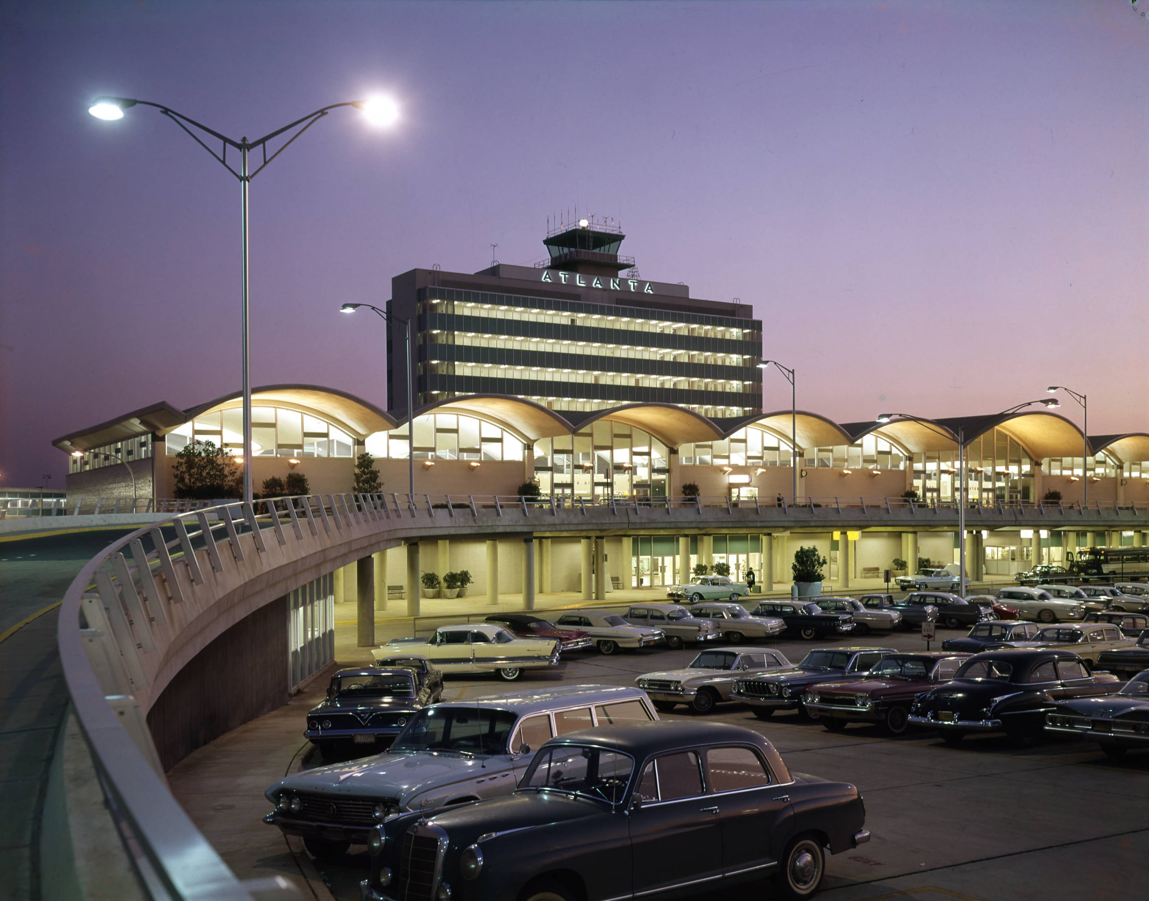 By the early '60s, a growing Atlanta needed a bigger, more modern airport and the newly-constructed terminal and complex fit the bill with its sleek, space-age design. The new $21 million terminal opened in May 1961 and it was, at the time, the largest airport terminal in the country.