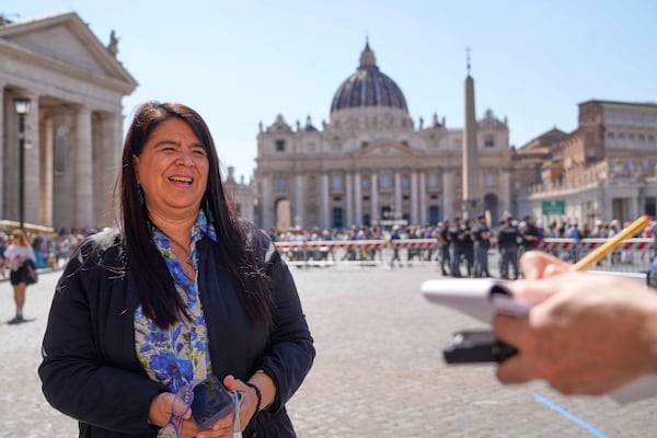 Peruvian investigative journalist Paola Margot Ugaz Cruz talks with the Associated Press near St. Peter's Square at the Vatican, Monday, May 19, 2025. (AP Photo/Gregorio Borgia)