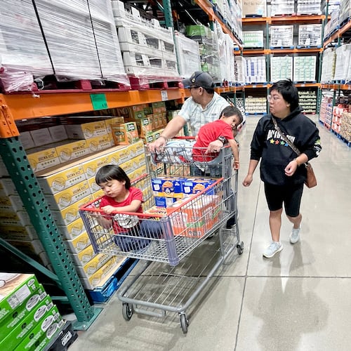KC Neufeld, right, shops with her family in Englewood, Colo., Wednesday, Oct. 29, 2025.
