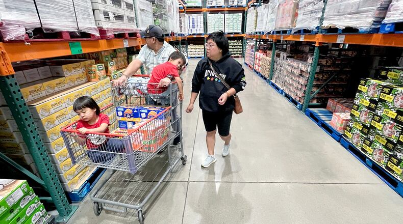 KC Neufeld, right, shops with her family in Englewood, Colo., Wednesday, Oct. 29, 2025.