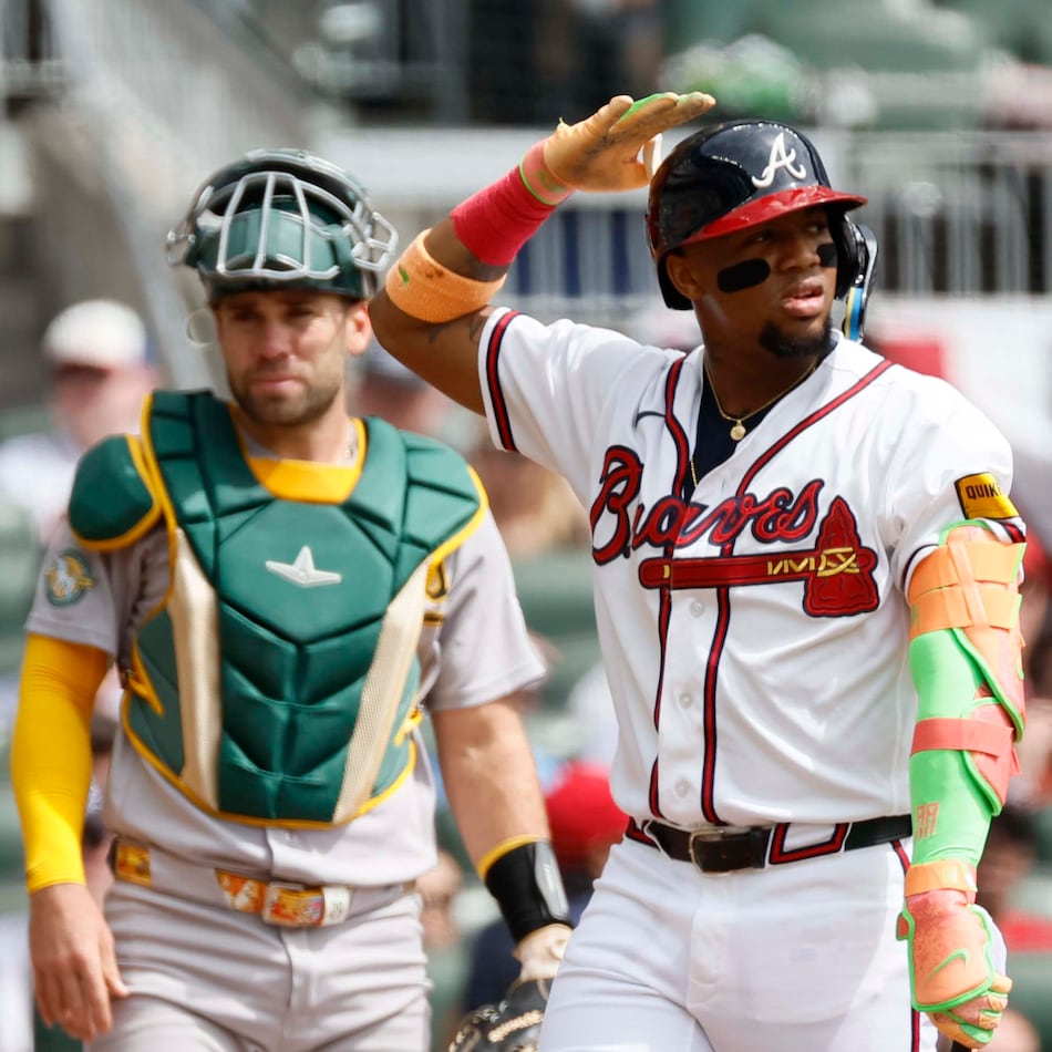 Ronald Acuña Jr. taps on his helmet to challenge an early season strike call. (Miguel Martinez/AJC)