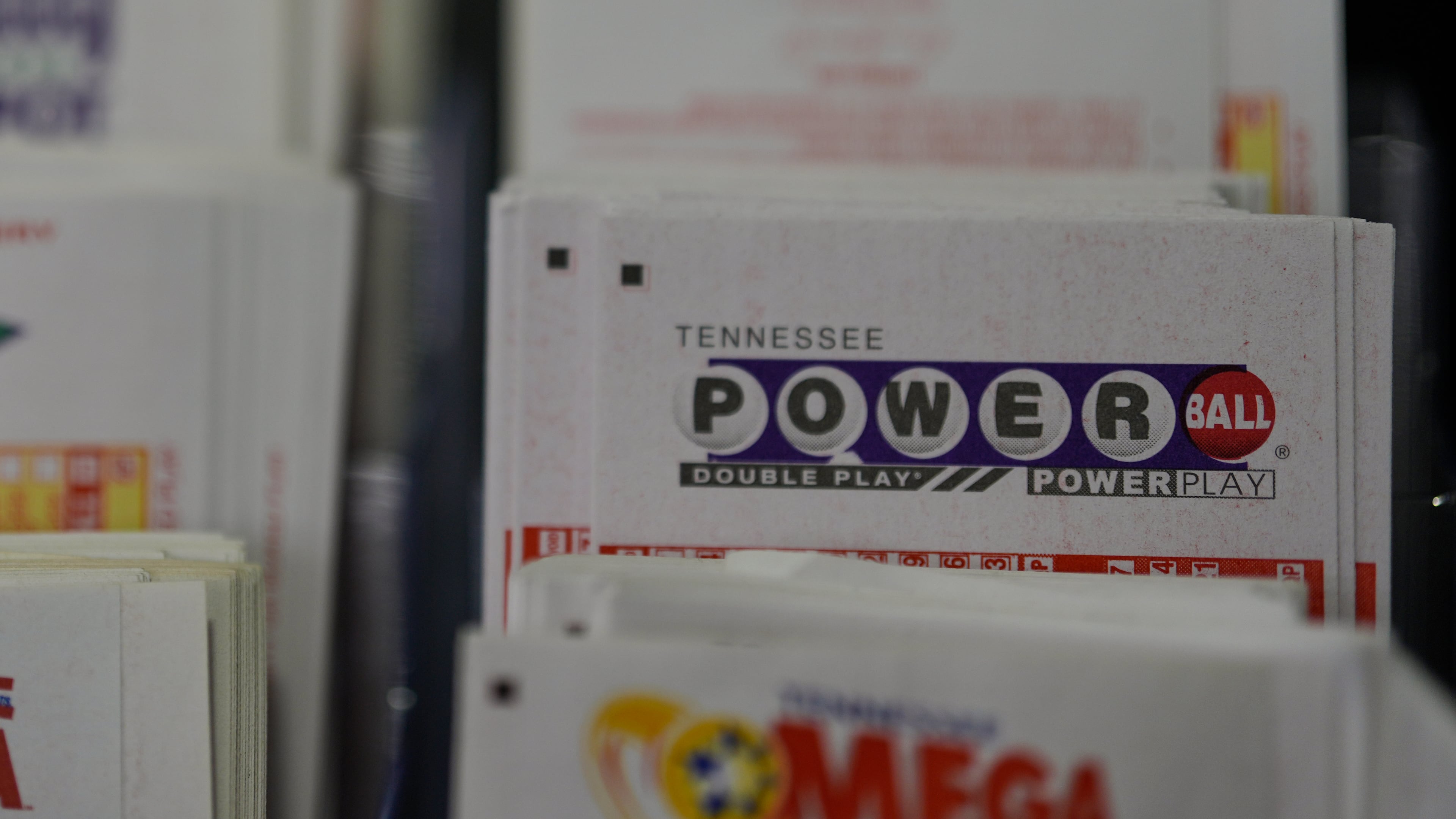 Powerball play slips are seen Friday, Aug. 29, 2025, in Nashville, Tenn. “If you ain’t in it, you can’t win it,” says 70-year-old Larry Moore. (George Walker IV/AP)