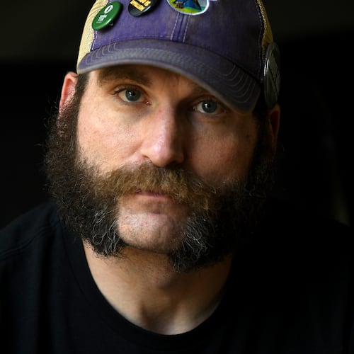 Joe Shearer, who was diagnosed with traumatic brain injuries from fighting in Iraq, poses for a portrait in his home in Colorado Springs, Colo., Wednesday, Aug. 5, 2026. (AP Photo/Thomas Peipert)