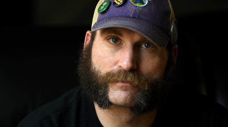 Joe Shearer, who was diagnosed with traumatic brain injuries from fighting in Iraq, poses for a portrait in his home in Colorado Springs, Colo., Wednesday, Aug. 5, 2026. (AP Photo/Thomas Peipert)