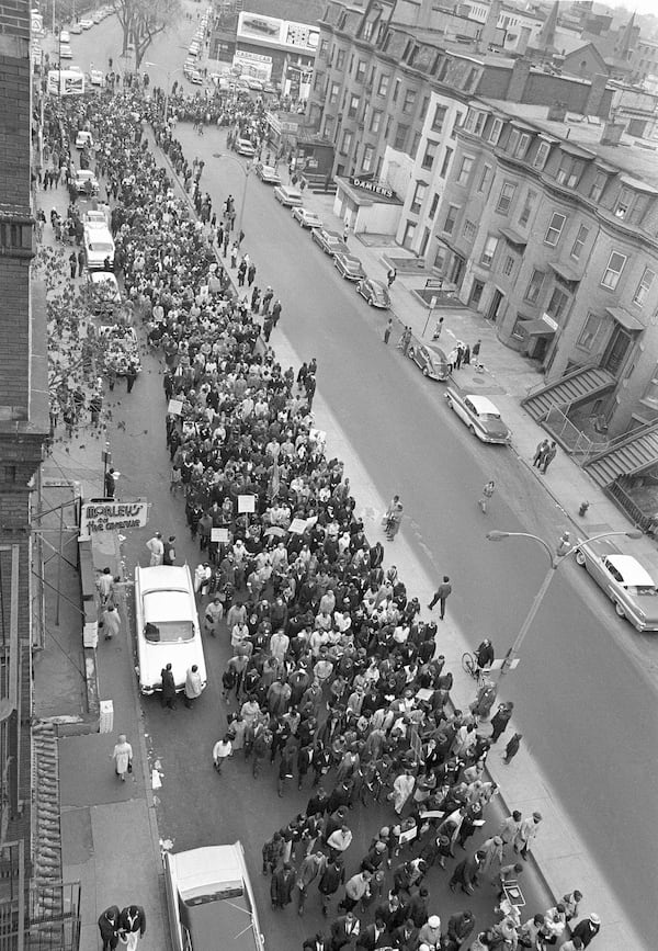 FILE - Civil rights marchers parade down Columbus Ave. in Boston led by Dr. Martin Luther King Jr., en route to historic Boston Common, April 25, 1965. (AP Photo, file)