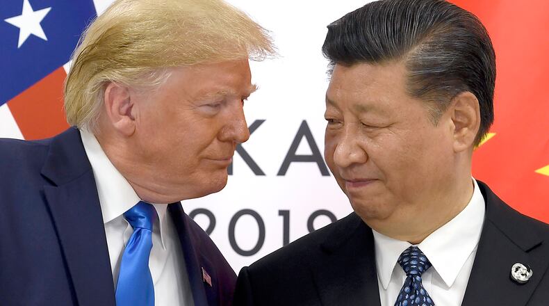 FILE - President Donald Trump, left, meets with Chinese President Xi Jinping during a meeting on the sidelines of the G-20 summit in Osaka, Japan, June 29, 2019. (AP Photo/Susan Walsh, File)