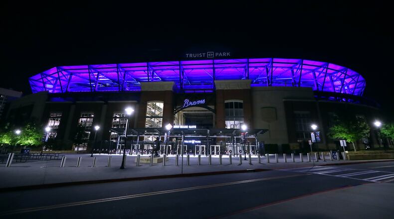 The Atlanta Braves Truist Park is transformed to blue as part of an initiative to salute essential workers on the frontlines of the coronavirus pandemic on Thursday, April 9, 2020, in Atlanta. The Light It Blue event includes more than 150 major sports and entertainment venues and historic landmarks and buildings across the United States.  Curtis Compton ccompton@ajc.com