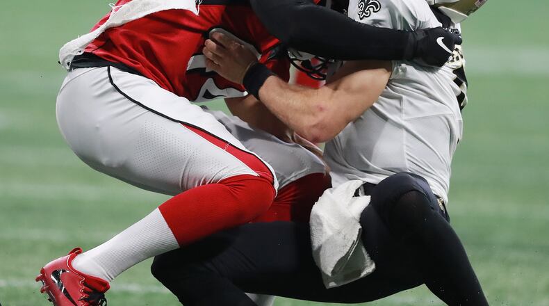 Atlanta Falcons linebacker Vic Beasley Jr. sacks New Orleans Saints quarterback Drew Brees during the third quarter in an NFL football game on Sunday, Sept 23, 2018, in Atlanta.   Curtis Compton/ccompton@ajc.com