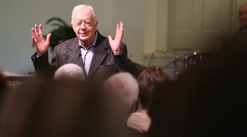 President Jimmy Carter talks to the overflow crowd at Maranatha Baptist Church in Plains on Sunday morning August 23, 2015 before teaching Sunday school. On Wednesday night, he’ll face a different audience when he answers questions from Emory University freshmen. Ben Gray / bgray@ajc.com