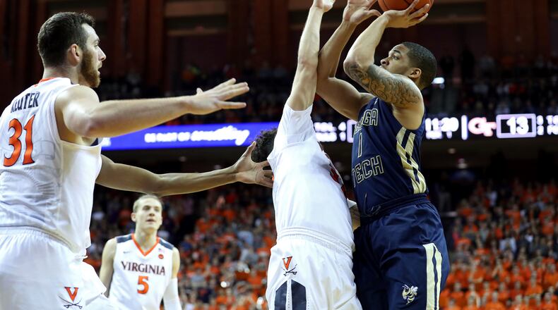 Georgia Tech guard Tadric Jackson (1) shoots over Virginia guard London Perrantes (32) during the first half of an NCAA college basketball game on Saturday, Jan. 21, 2017, in Charlottesville, Va. (AP Photo/Ryan M. Kelly)