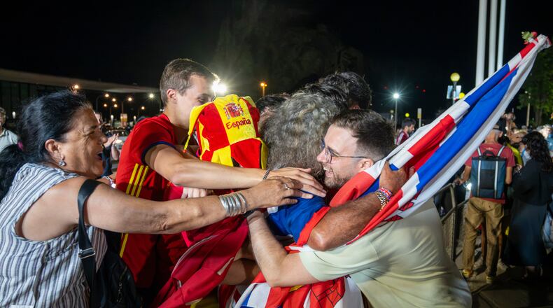 British and Spanish nationals celebrate passport-free travel after a new EU-U.K. treaty took effect at the border crossing between Gibraltar and Spain in La Línea de la Concepción, Spain, Wednesday, July 15, 2026. (AP Photo/Marcos Moreno)