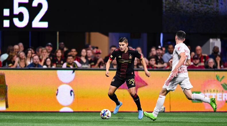 Atlanta United forward Ronaldo Cisneros #29 dribbles th ball during the match against New York Red Bulls at Mercedes-Benz Stadium in Atlanta, United States on Wednesday August 17, 2022. (Photo by Mitchell Martin/Atlanta United)