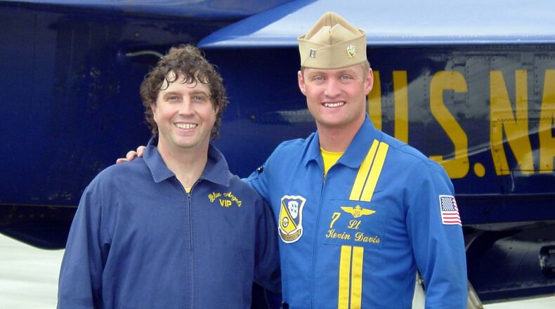 060426 - MARIETTA, GA -- AJC reporter Steve Beatty, left, and Blue Angel pilot Lt. Kevin Davis (cq), right, pose for a photo at Naval Air Station Atlanta after Davis took Beatty for a ride in his F/A-18 fighter April 26, 2006. (photo by Harrison Carter)