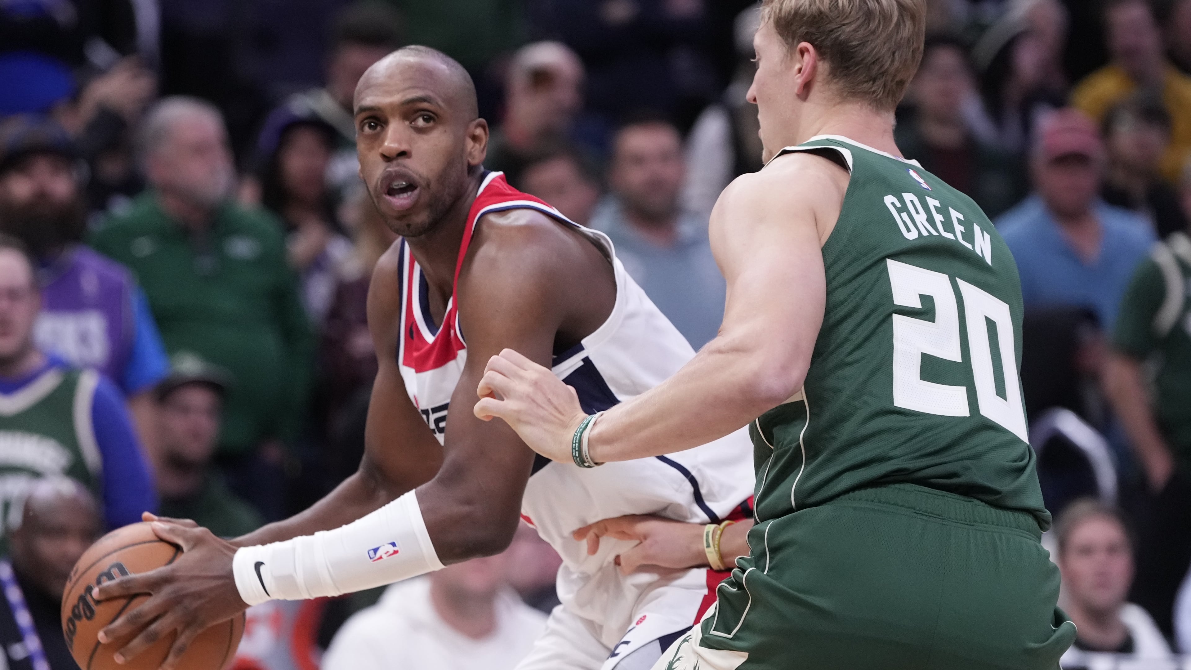 Washington Wizards' Khris Middleton tries to get past Milwaukee Bucks' AJ Green during the first half of an NBA basketball game Wednesday, Oct. 22, 2025, in Milwaukee. (AP Photo/Morry Gash)