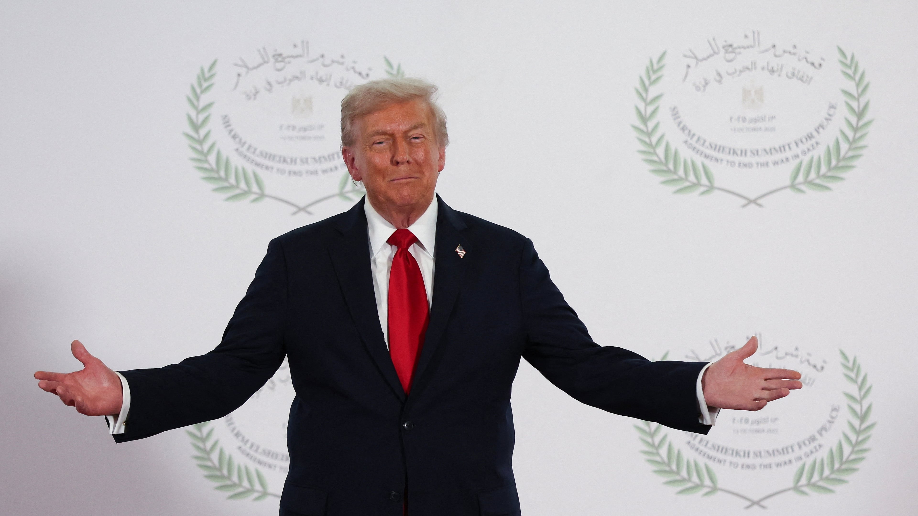 President Donald Trump waits to greet leaders during a summit to support ending the more than two-year Israel-Hamas war in Gaza after a breakthrough ceasefire deal, Monday, Oct. 13, 2025, in Sharm El Sheikh, Egypt. (Suzanne Plunkett/Pool via AP)