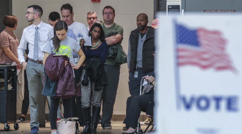 Voters waited over an hour to vote at Henry W. Grady High School in Atlanta on Tuesday. JOHN SPINK / JSPINK@AJC.COM