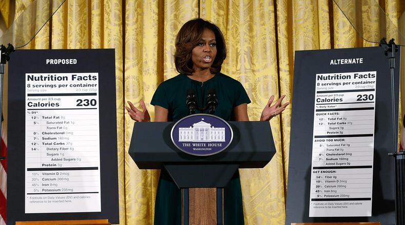WASHINGTON, DC - FEBRUARY 27: U.S. first lady Michelle Obama announces proposed changes to food labels during an event in the East Room of the White House February 27, 2014 in Washington, DC. The proposed changes would highlight the calorie count of all foods, detail added sugars, and prove easier to understand the basic nutritional value of packaged foods. (Photo by Win McNamee/Getty Images)