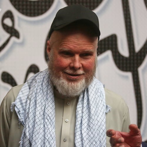 American Dennis Coyle smiles after being released by Afghanistan's Taliban authorities, who had held him for over a year, before boarding a plane at the airport in Kabul, Afghanistan, Tuesday, March 24, 2026. (AP Photo/Mudassir Safi)