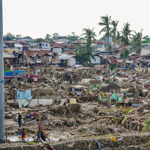 In this photo provided by the Malacanang Presidential Communications Office, damaged homes beside Mananga Bridge in Talisay, Cebu Province, central Philippines on Friday Nov. 7, 2025 after Typhoon Kalmaegi devastated the province and claimed lives. (Malacanang Presidential Communications Office via AP)